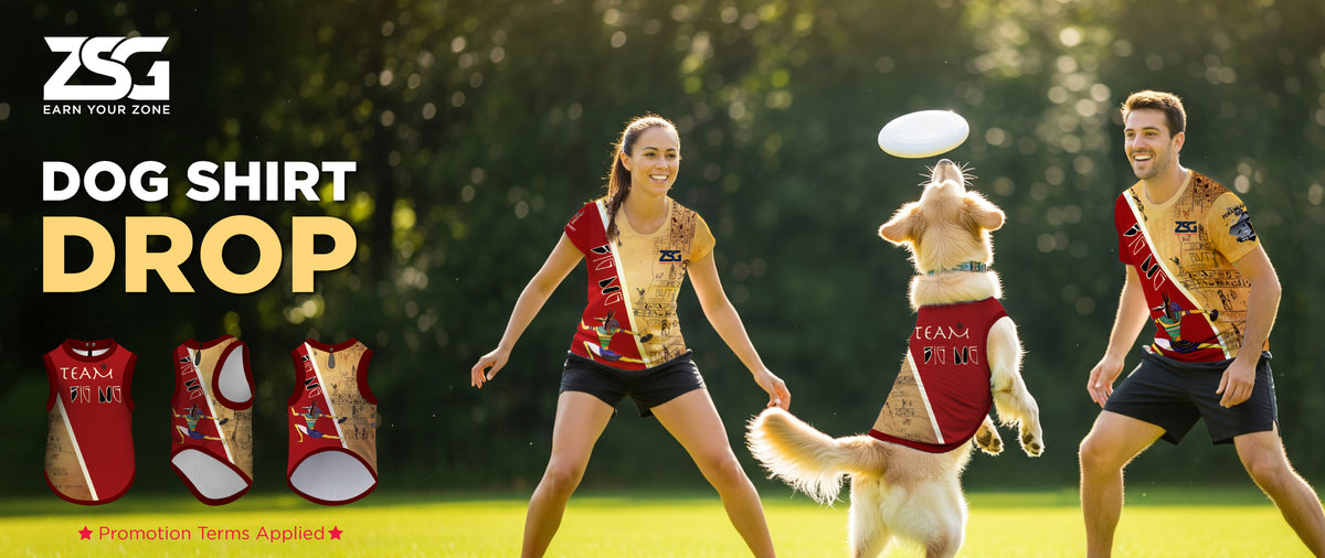 Two ultimate players playing with a dog wearing a custom dog shirt on a grassy field.